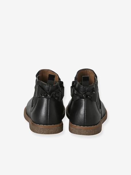 Pair of baby first steps boots black+golden yellow 